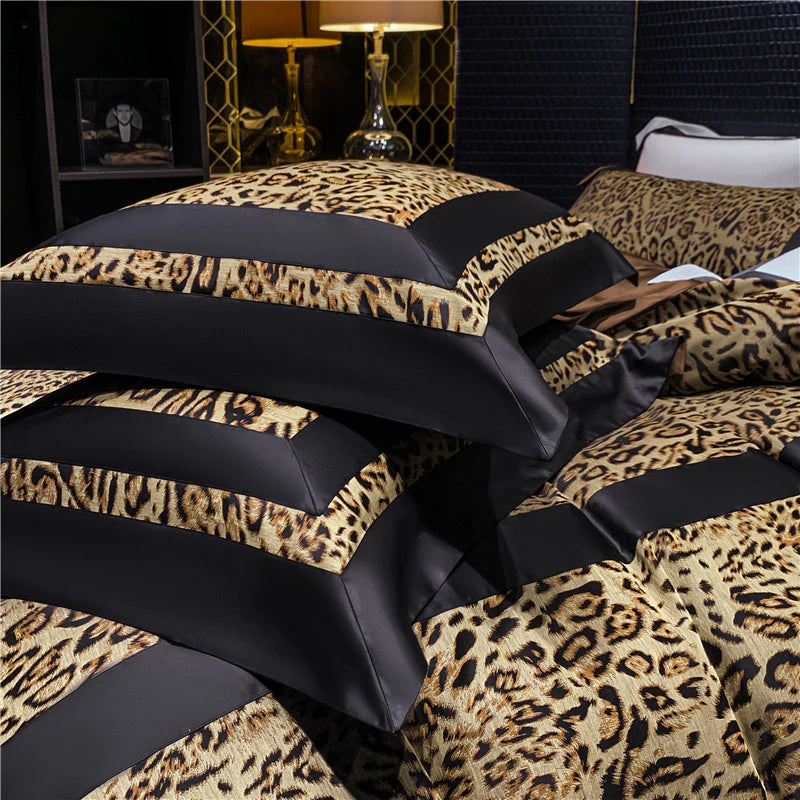Leopard print bedding set with black accents on a bed in a bedroom setting.