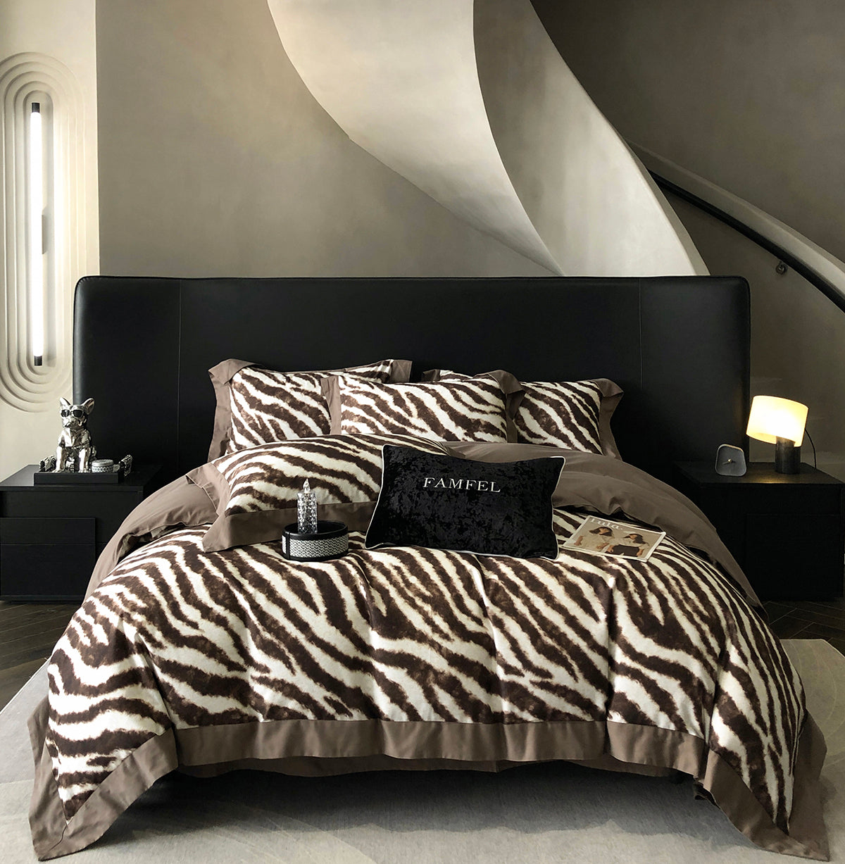 Modern bedroom with zebra print bedding and black headboard