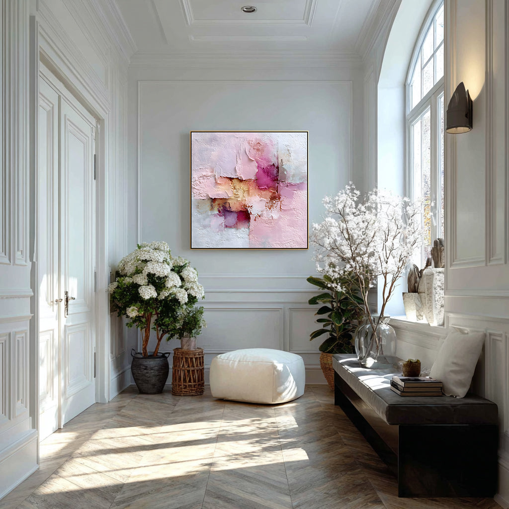 Modern interior with abstract art, plants, and a bench in a well-lit room.