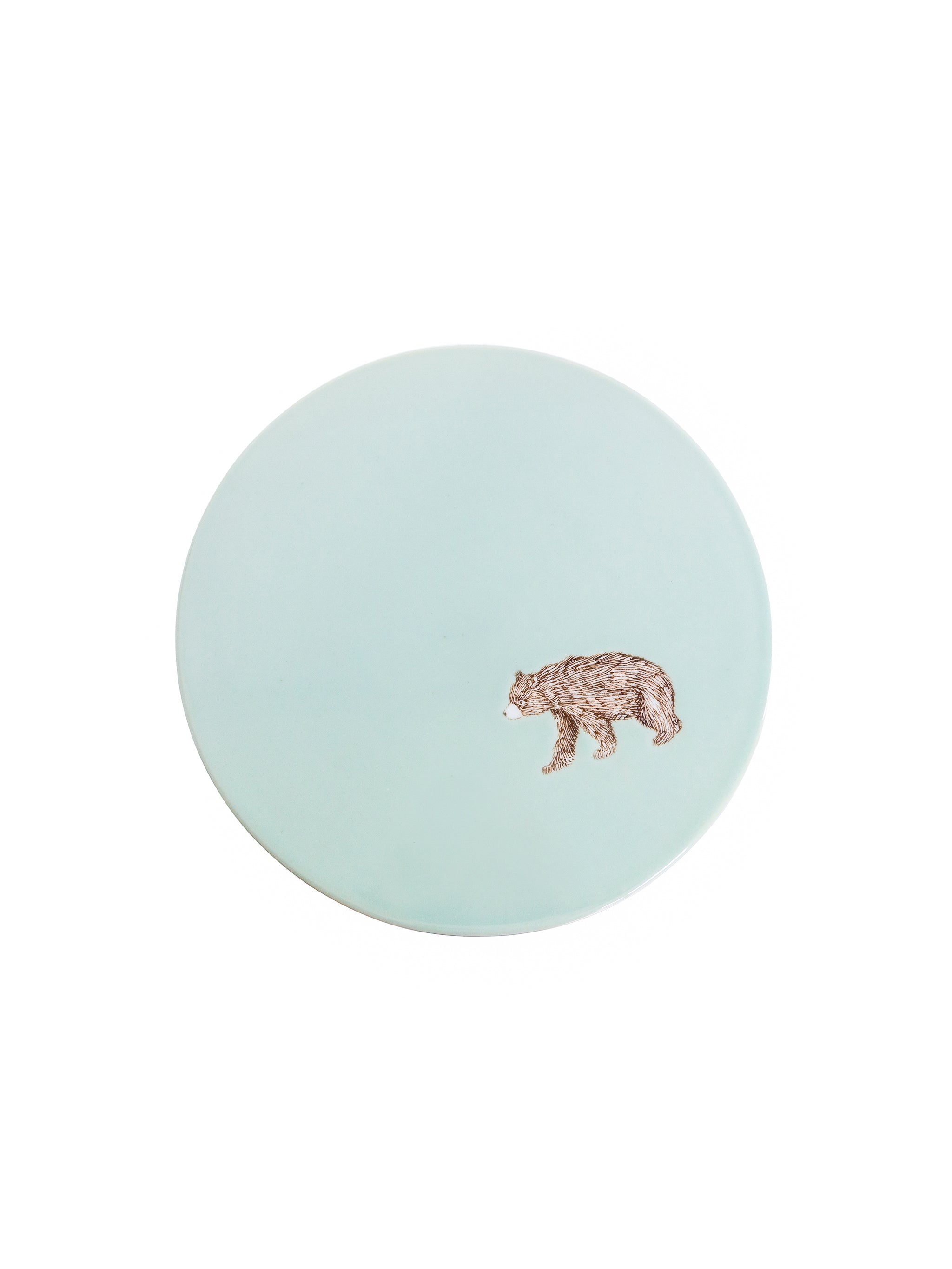 Round light blue coaster with a panther design on a white background