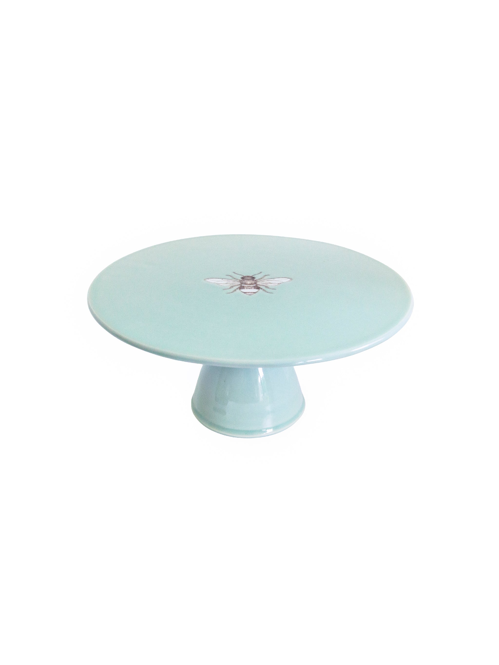 Light blue cake stand with a decorative bee emblem on a white background