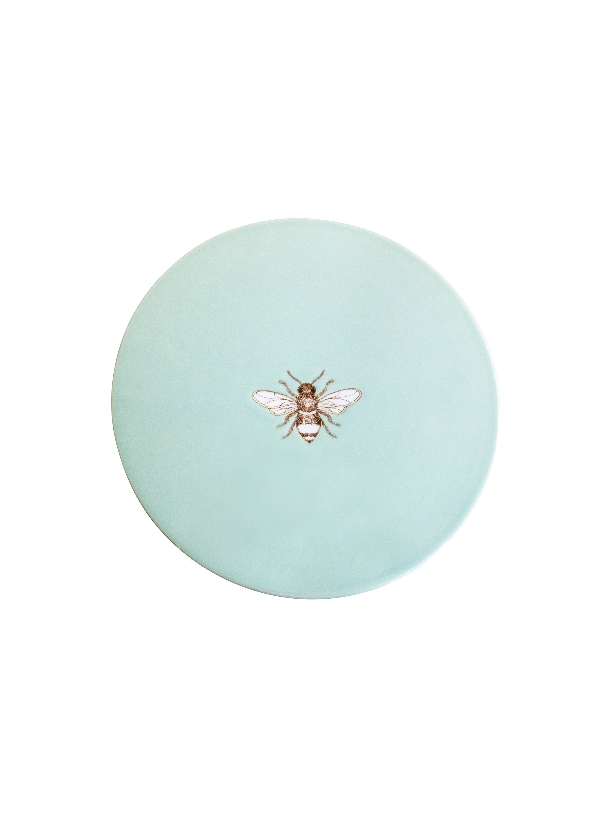 Round light blue cake stand seen from above, with a bee design on a white background
