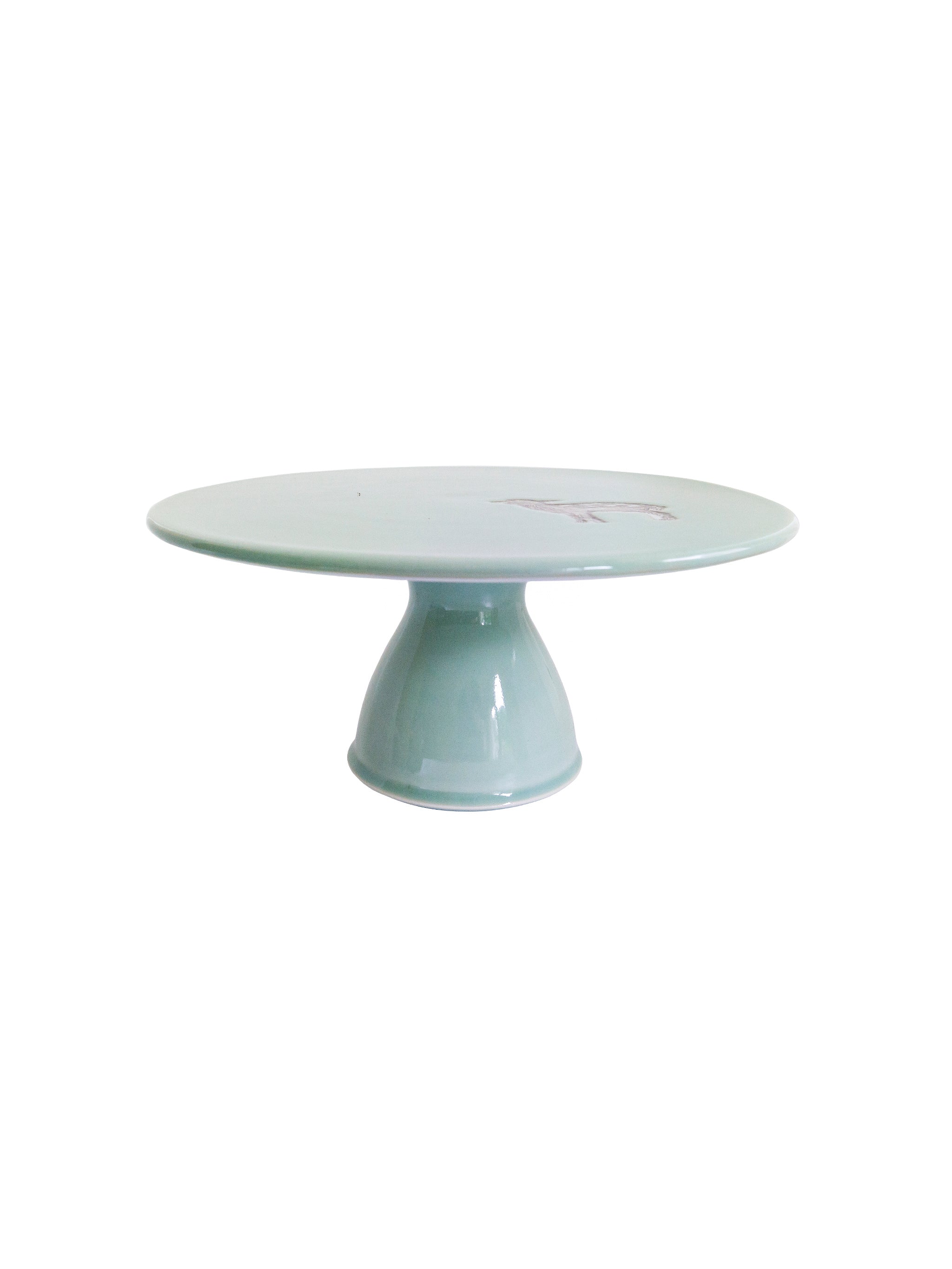 Light blue ceramic cake stand with a fawn emblem on a white background