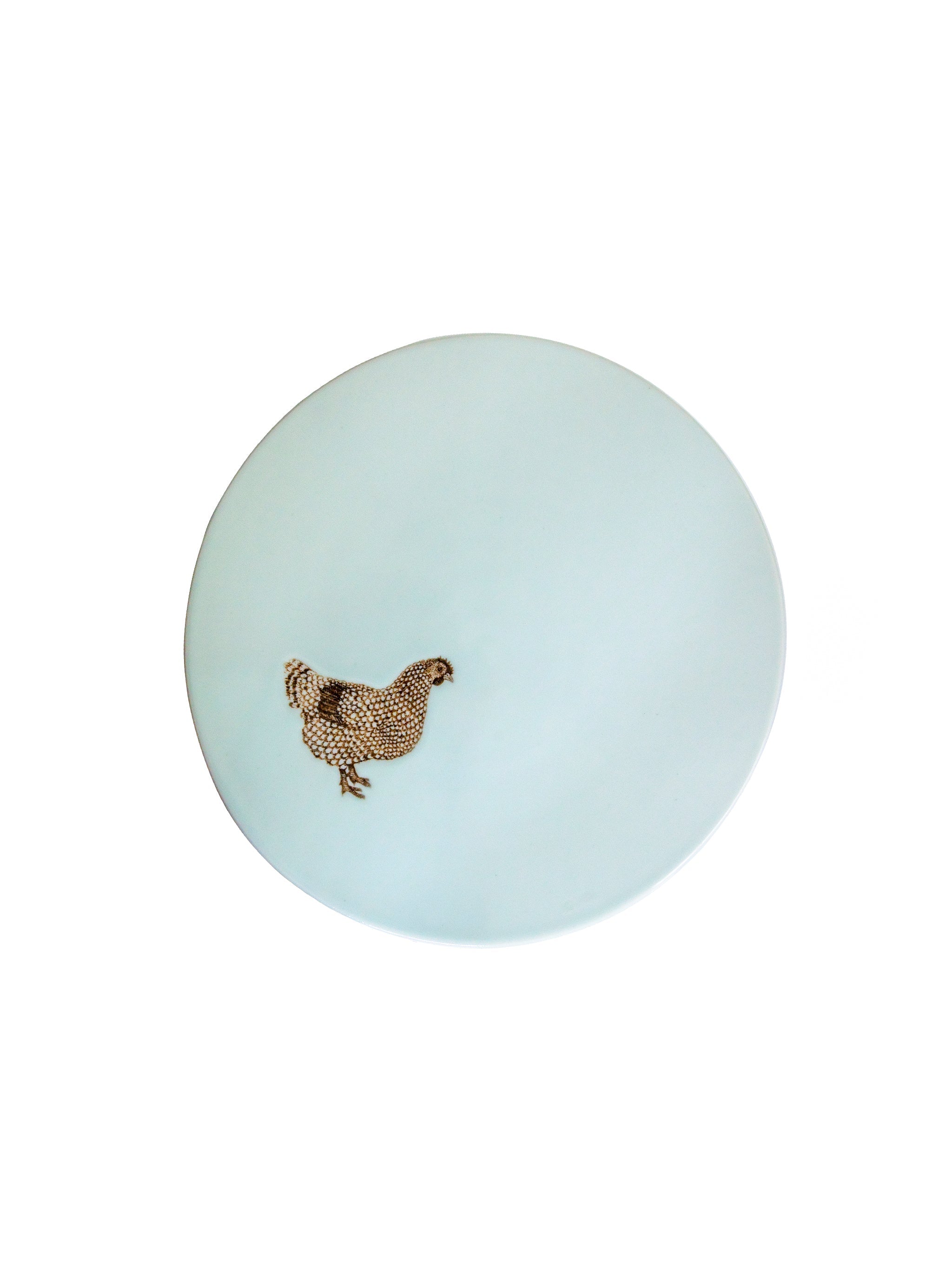 Light blue cake stand seen from above with a chicken design on a white background