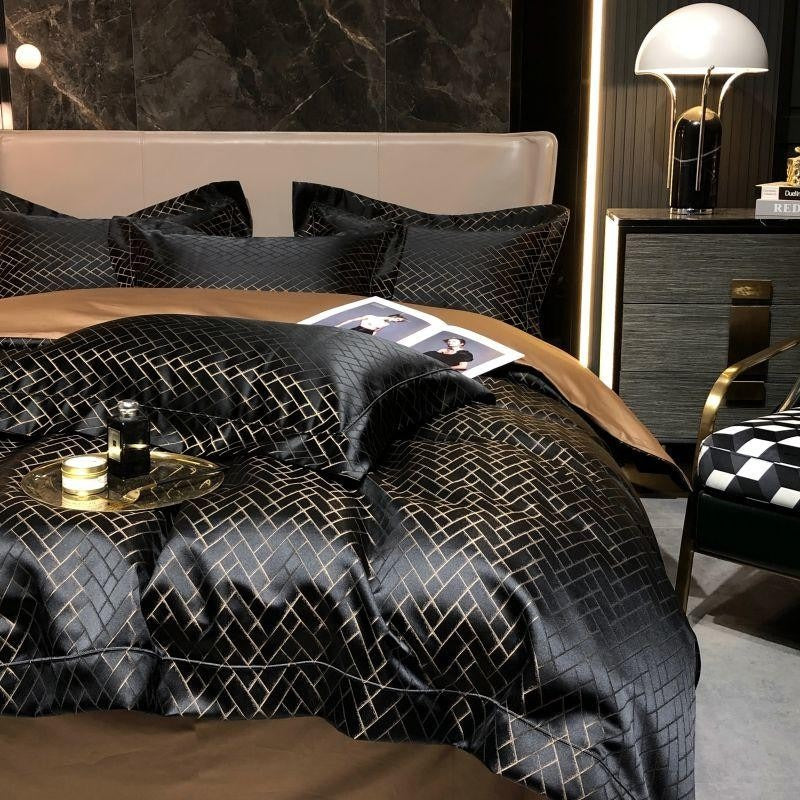 Luxurious bedroom with a bed covered in black quilt with geometric pattern, nightstands, and decorative items.