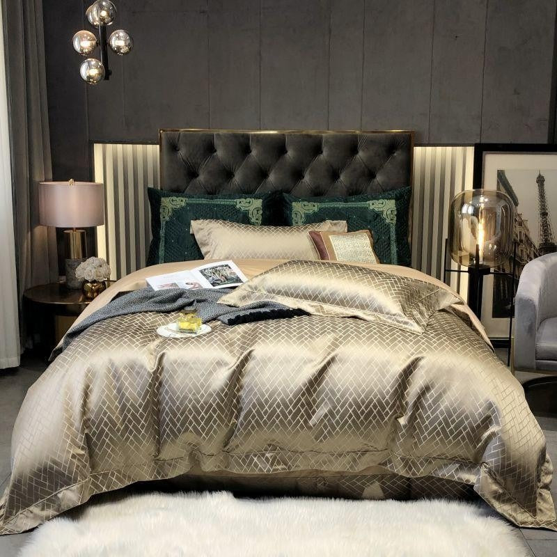 Luxurious bedroom with a large bed, decorative pillows, and a stylish headboard.