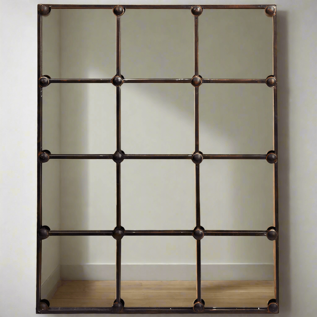 Decorative metal wall mirror with grid design on a plain background