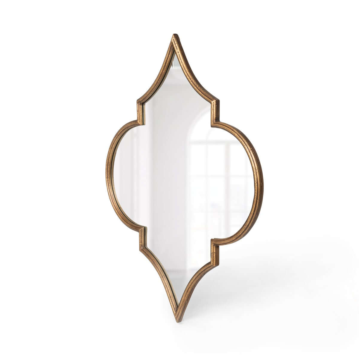 Decorative wall mirror with a gold frame on a white background