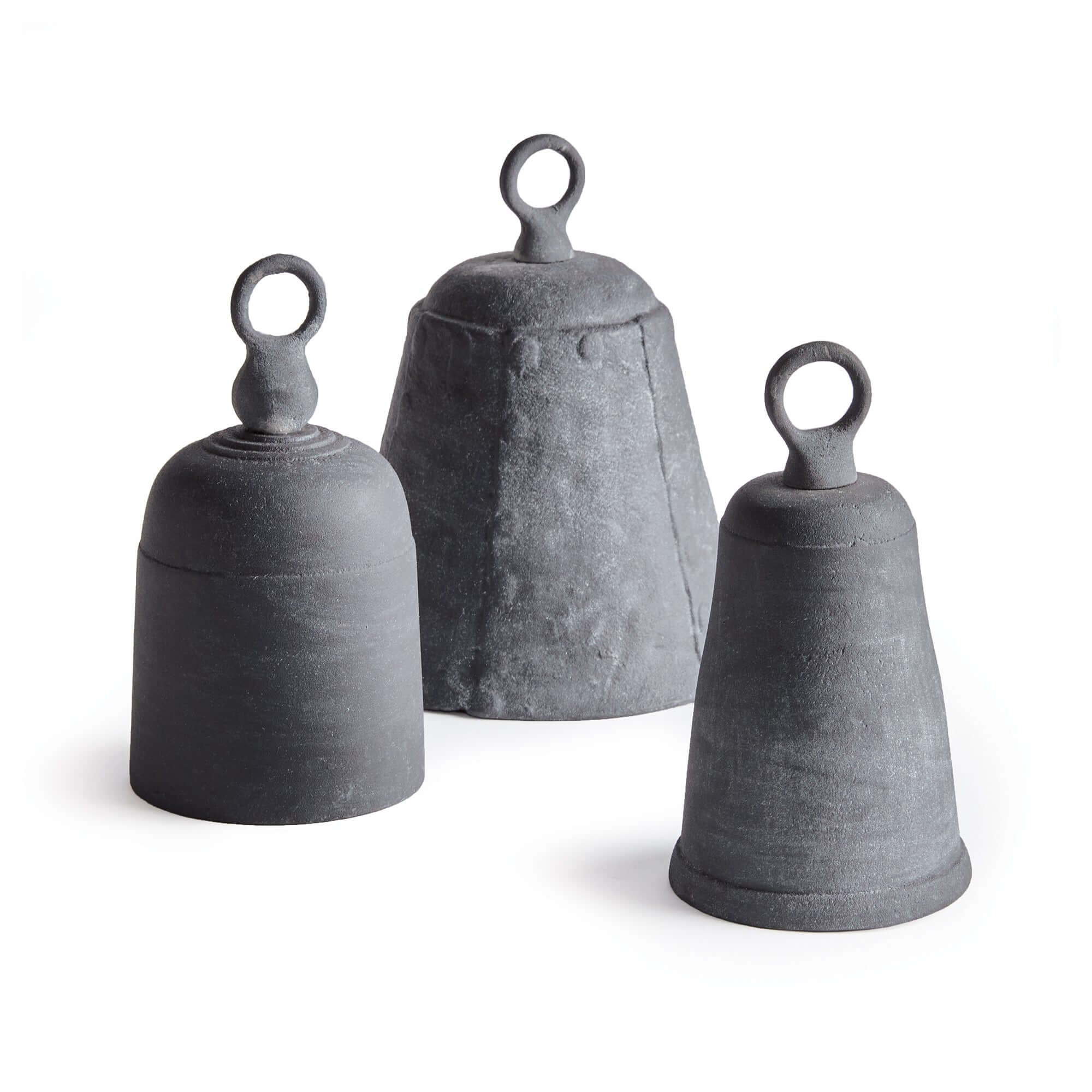 Three gray stone bells of varying sizes on a white background