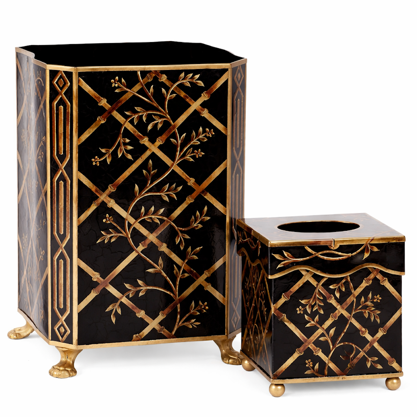 Decorative black and gold bathroom set with hexagonal trash can and tissue box on a white background