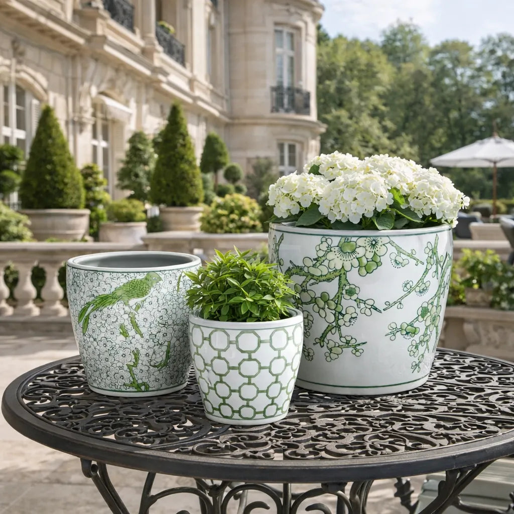 Decorative outdoor planters on a table with a classical building in the background