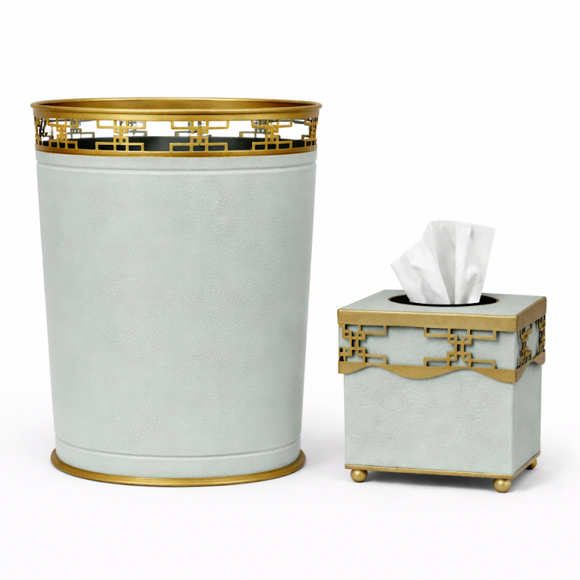 Decorative soft green fretwork trash can and tissue box set with gold accents on a white background