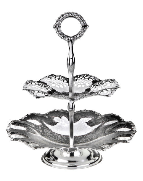 Silver two-tiered serving tray with intricate design on a white background
