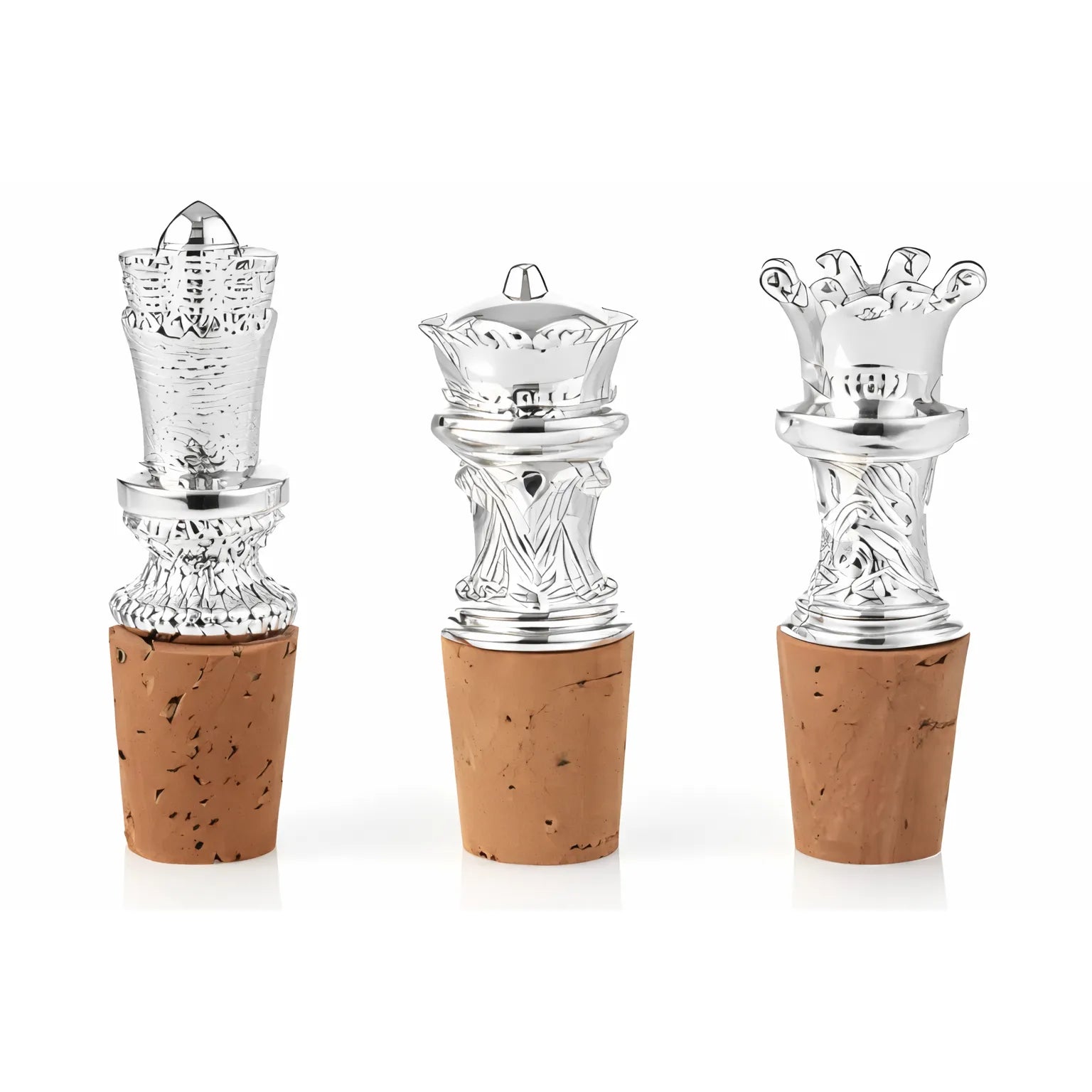 Set of three silver plate wine bottle stoppers with crown-shaped tops and natural cork bases on a white background