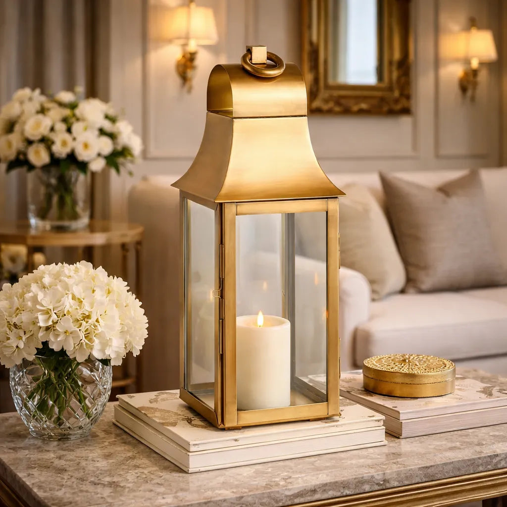 Brass lantern with a candle on a table in a living room setting