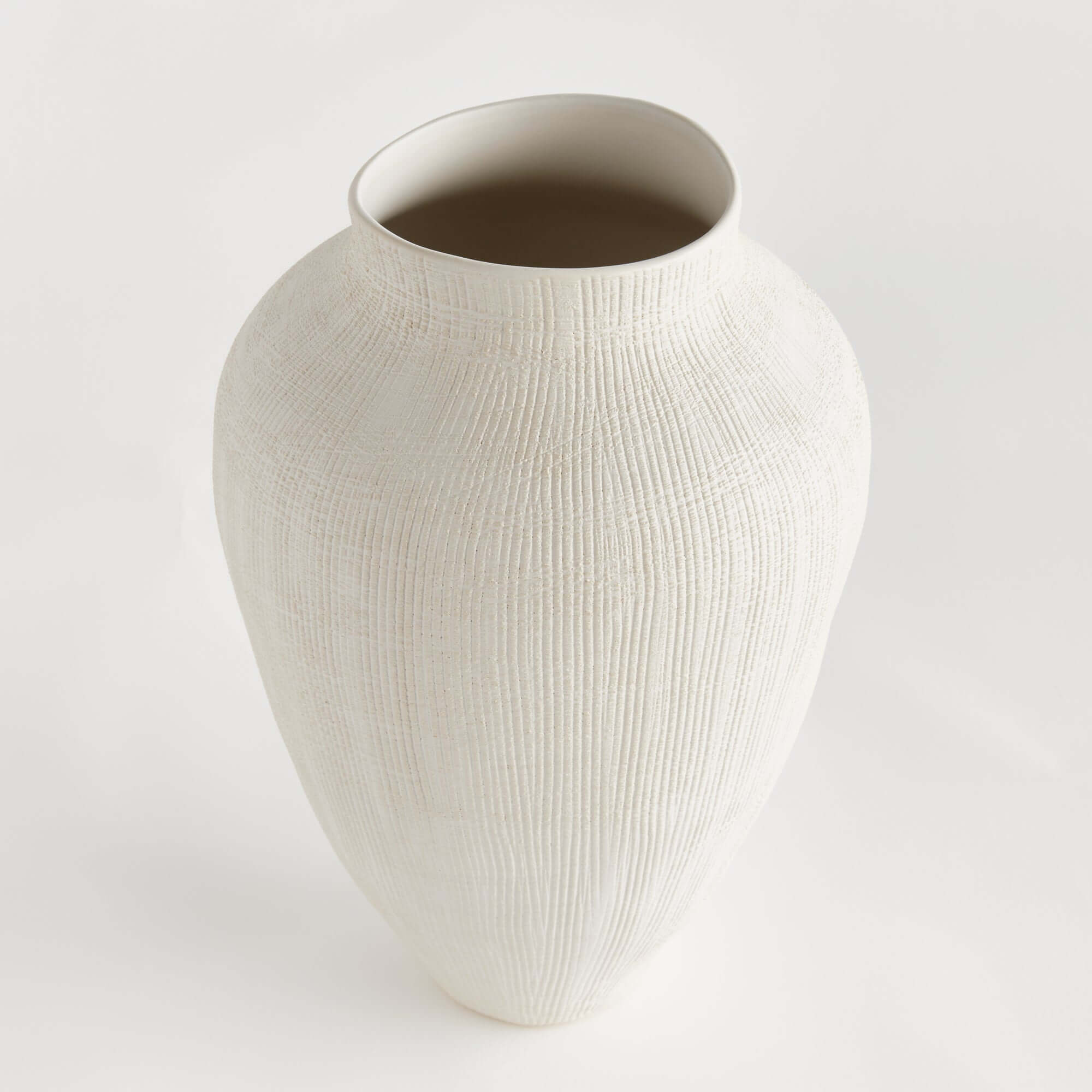 White textured vase on a light gray background