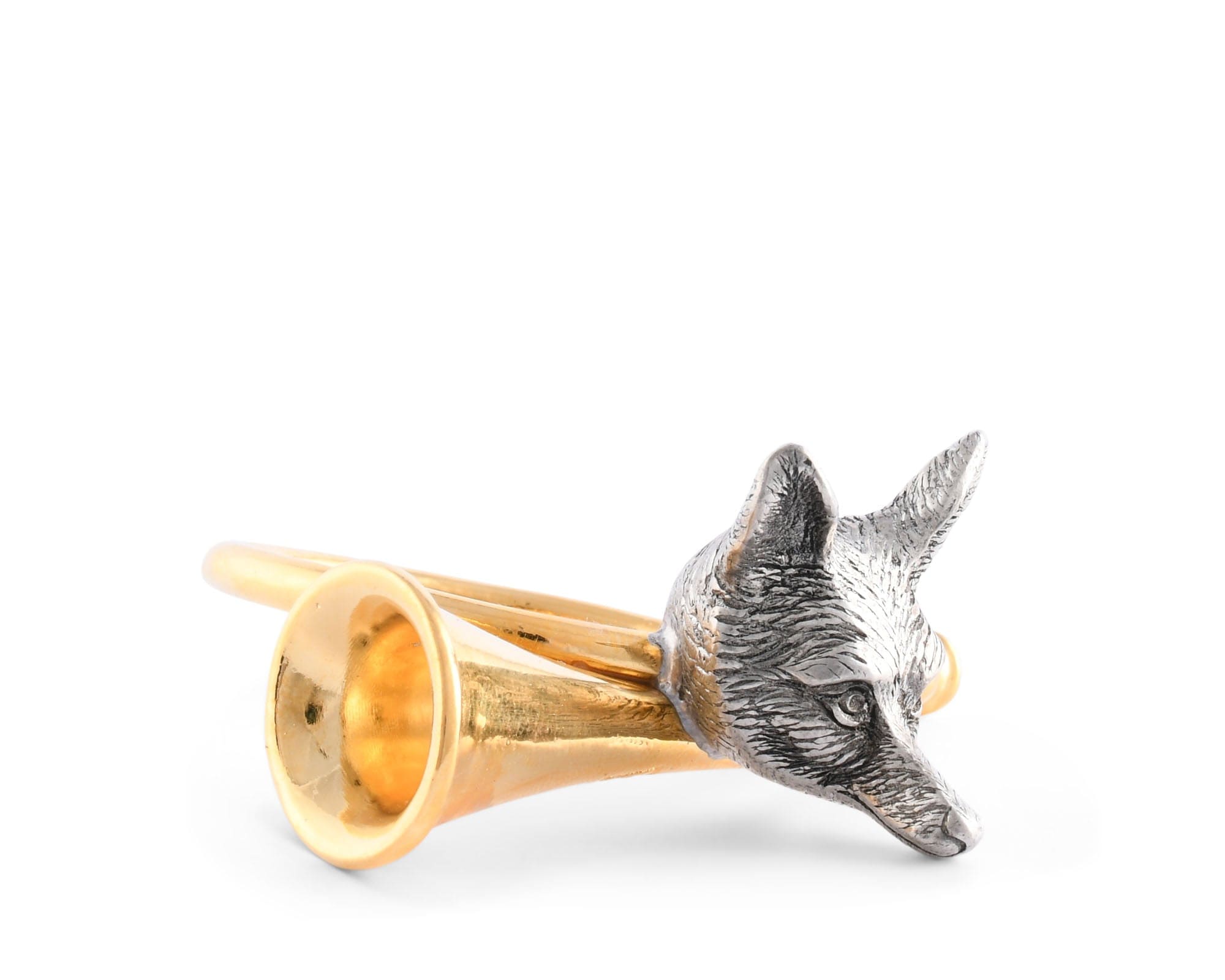 Side angle of a gold and pewter fox-shaped napkin ring on a white background