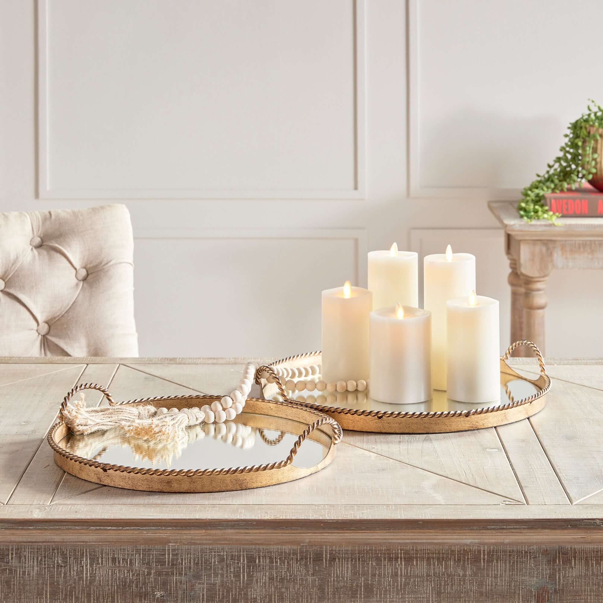 Decorative candles on a wooden table with a neutral background