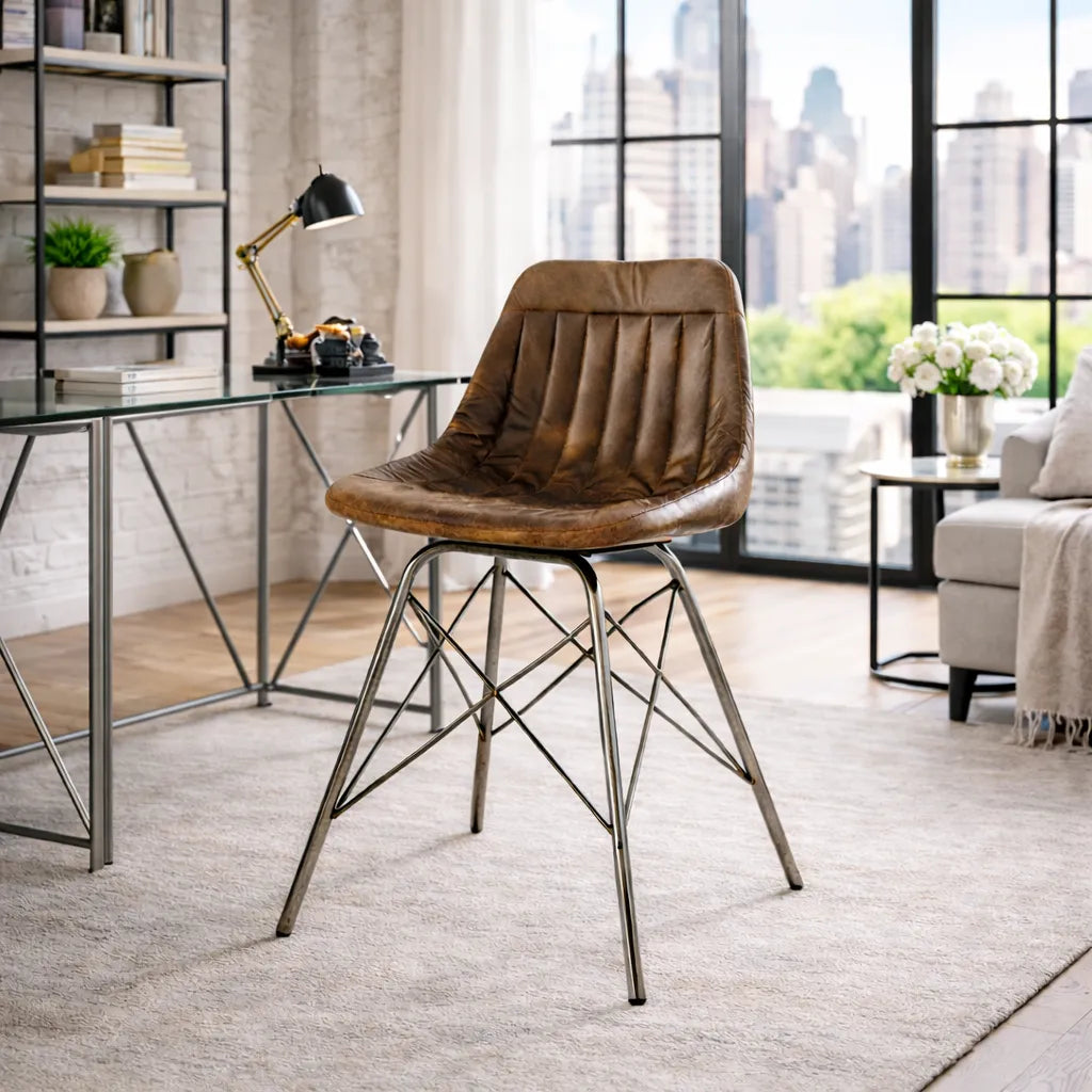 Brown leather chair with metal legs in a modern living room setting.
