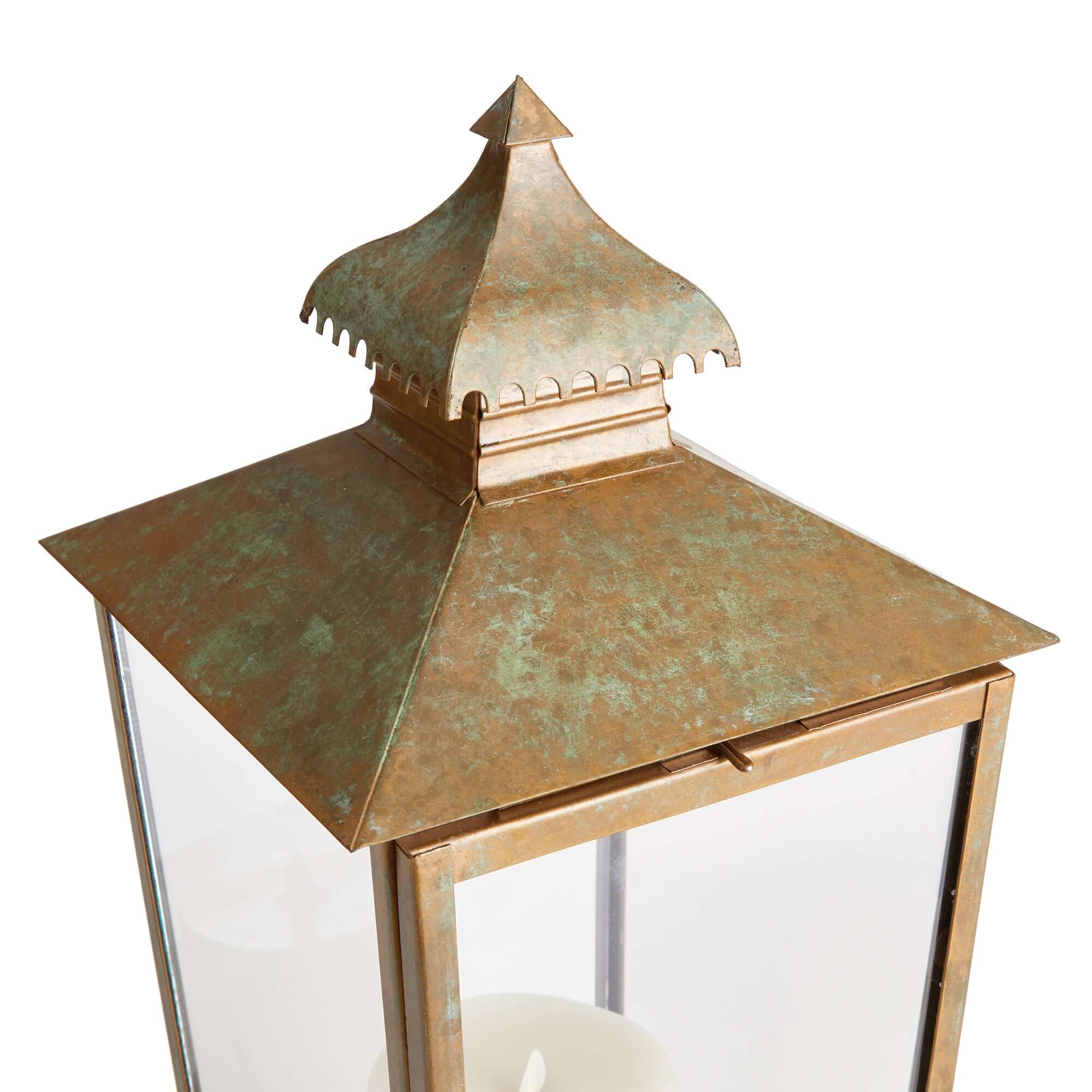 Bronze lantern with a detailed pagoda on a white background